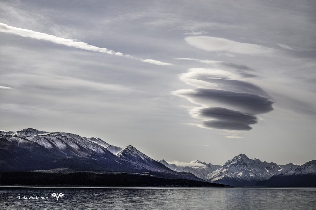 Strange cloud over snowy mountain